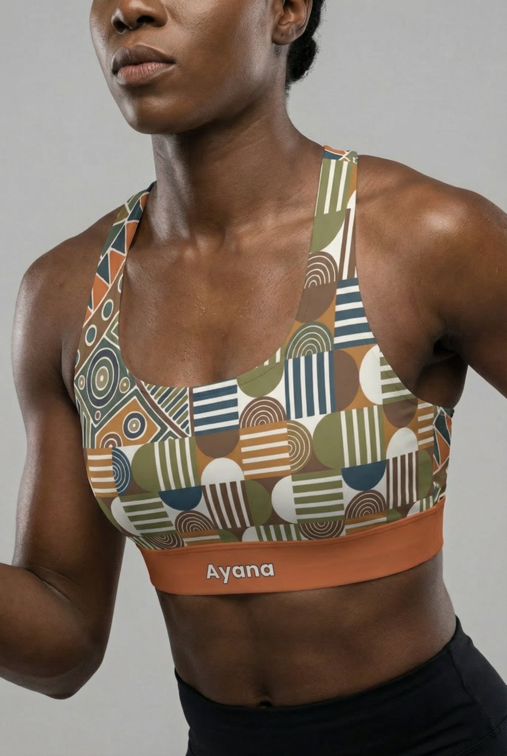 Person wearing a patterned sports bra with 'OnlyBulked' branding on a gray background