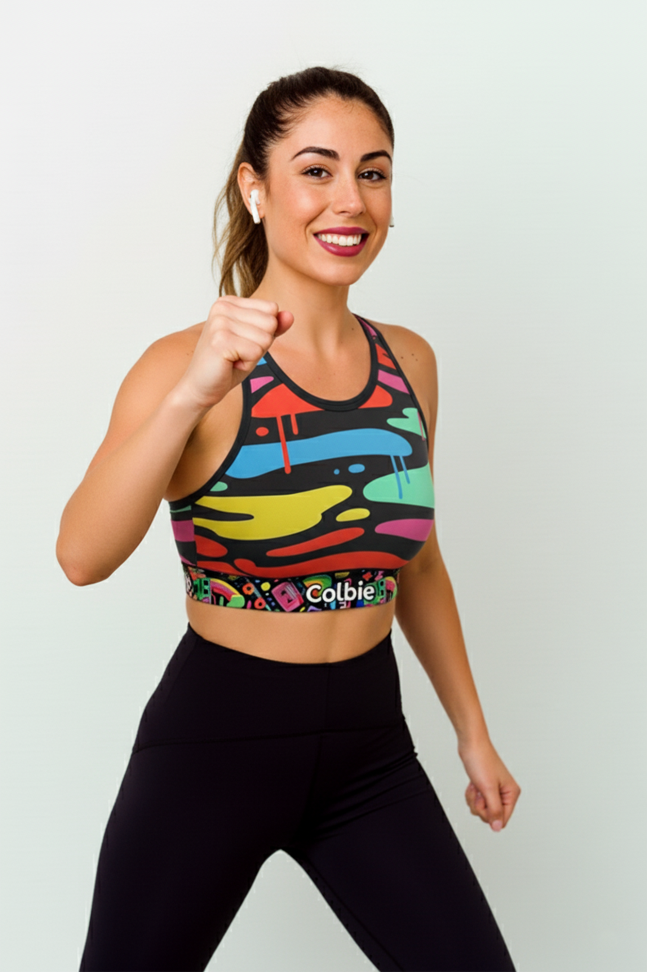 Woman wearing custom name sports bra, colorful print activewear