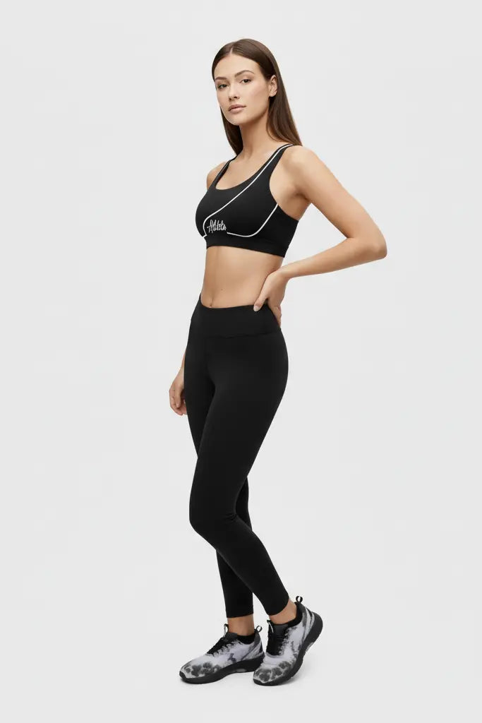 Woman wearing a beige sports bra with 'Athleta' name. OnlyBulked brand.