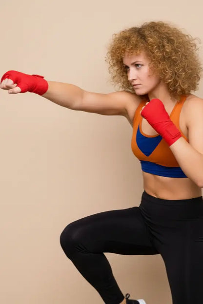 Anime warrior colorblock sports bra — side profile showing layered armor‑style panels