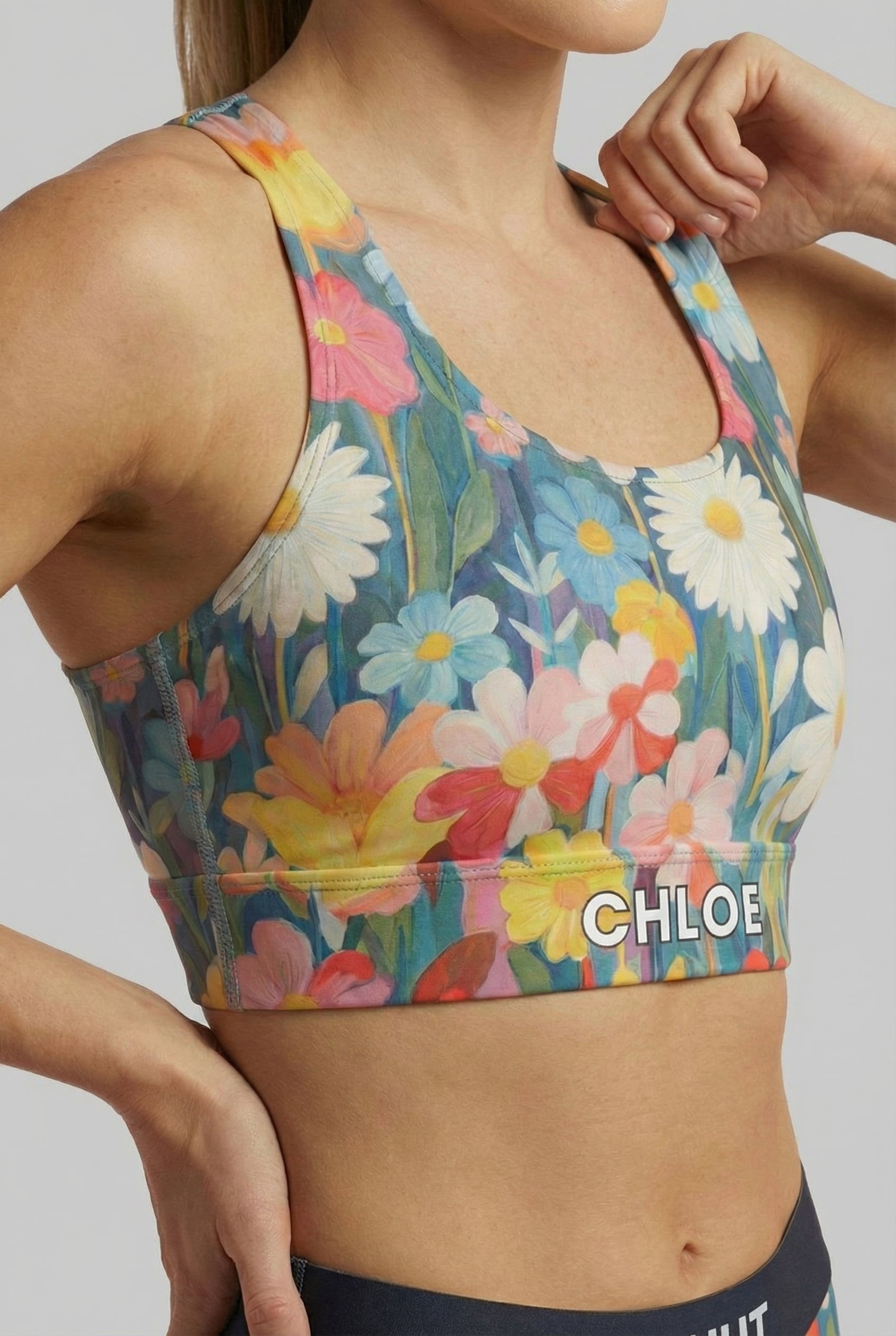 Soft hand-painted flower print activewear in blue, pink and yellow.