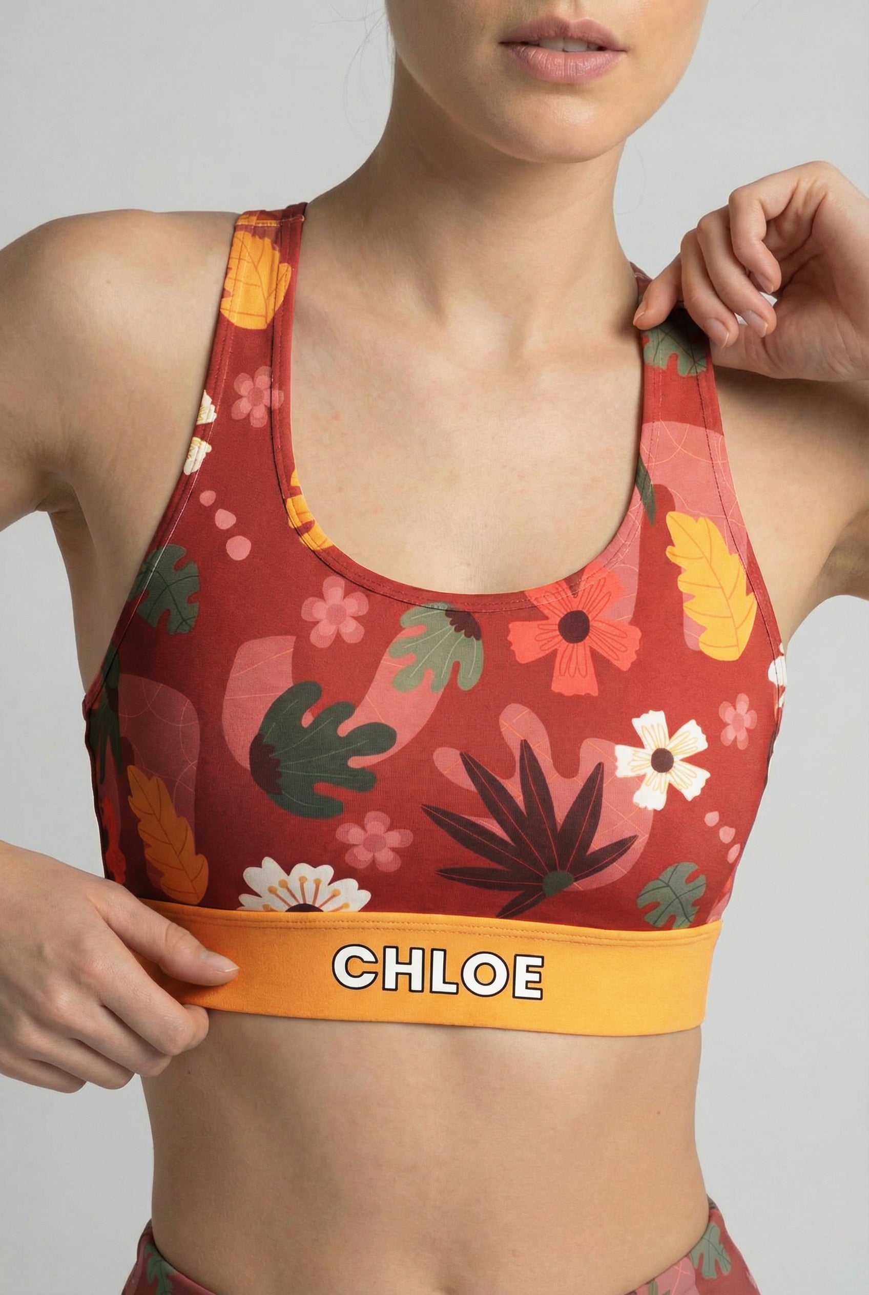 Woman wearing personalized rustic floral sport bra with racerback design.
