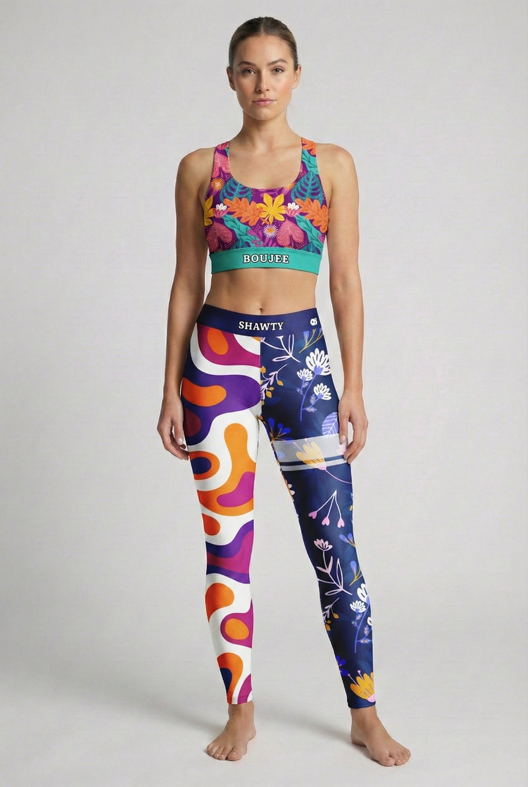 Woman wearing high-waisted personalized leggings with two different leg designs.