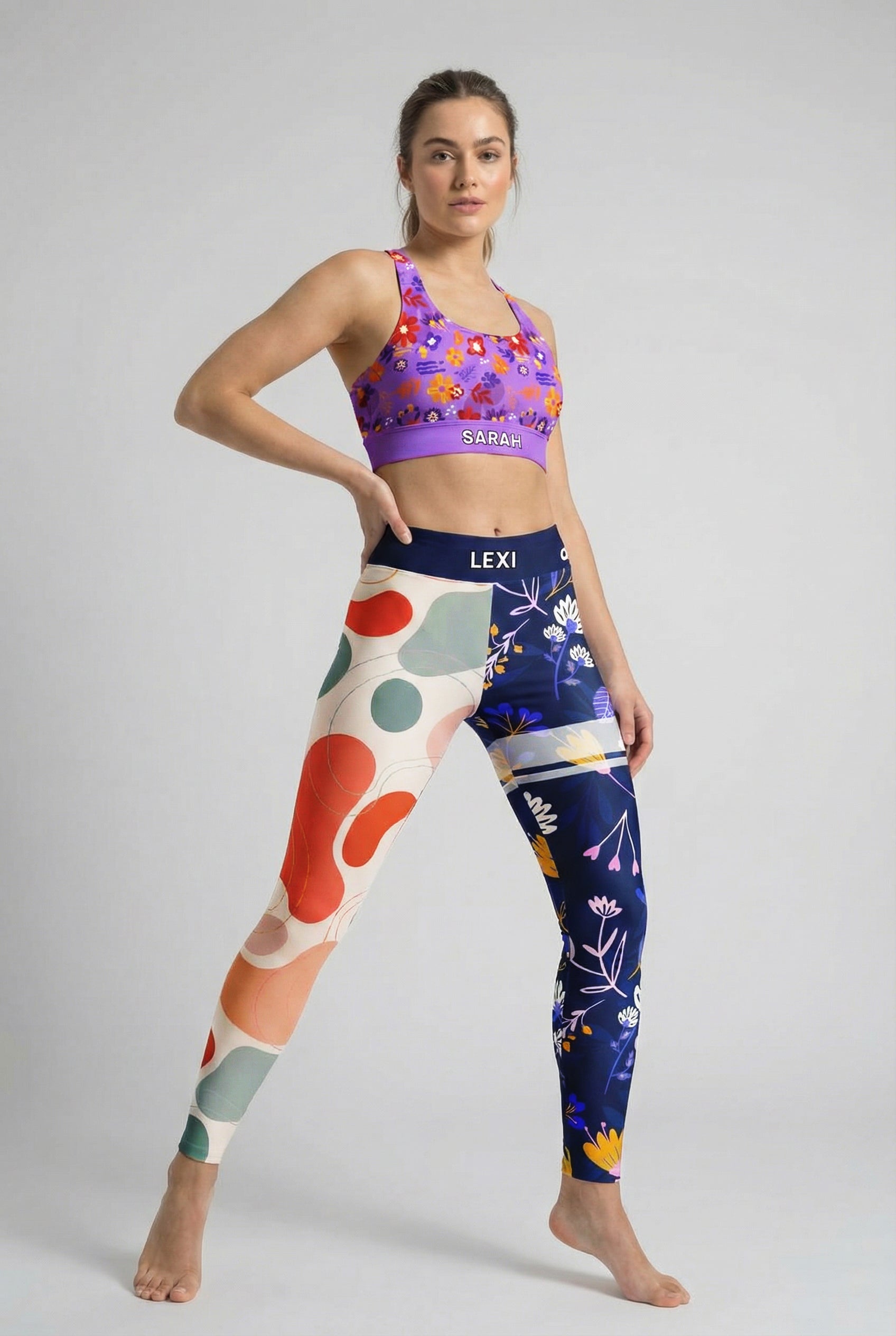 Woman wearing personalized asymmetrical leggings with modern art design.