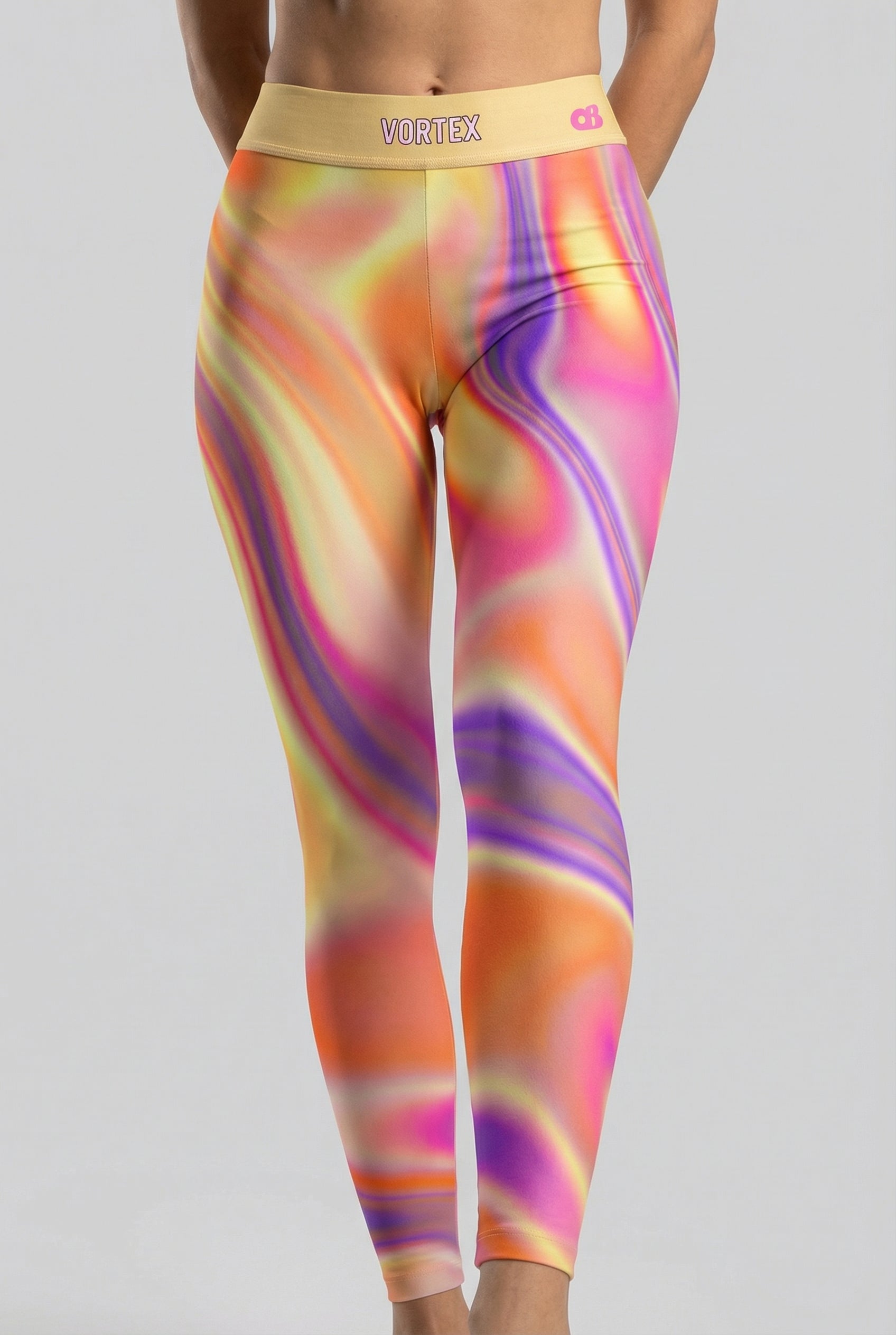 Front view of orange, yellow, and purple tie-dye swirl leggings featuring 'VORTEX' printed on the pastel yellow waistband.
