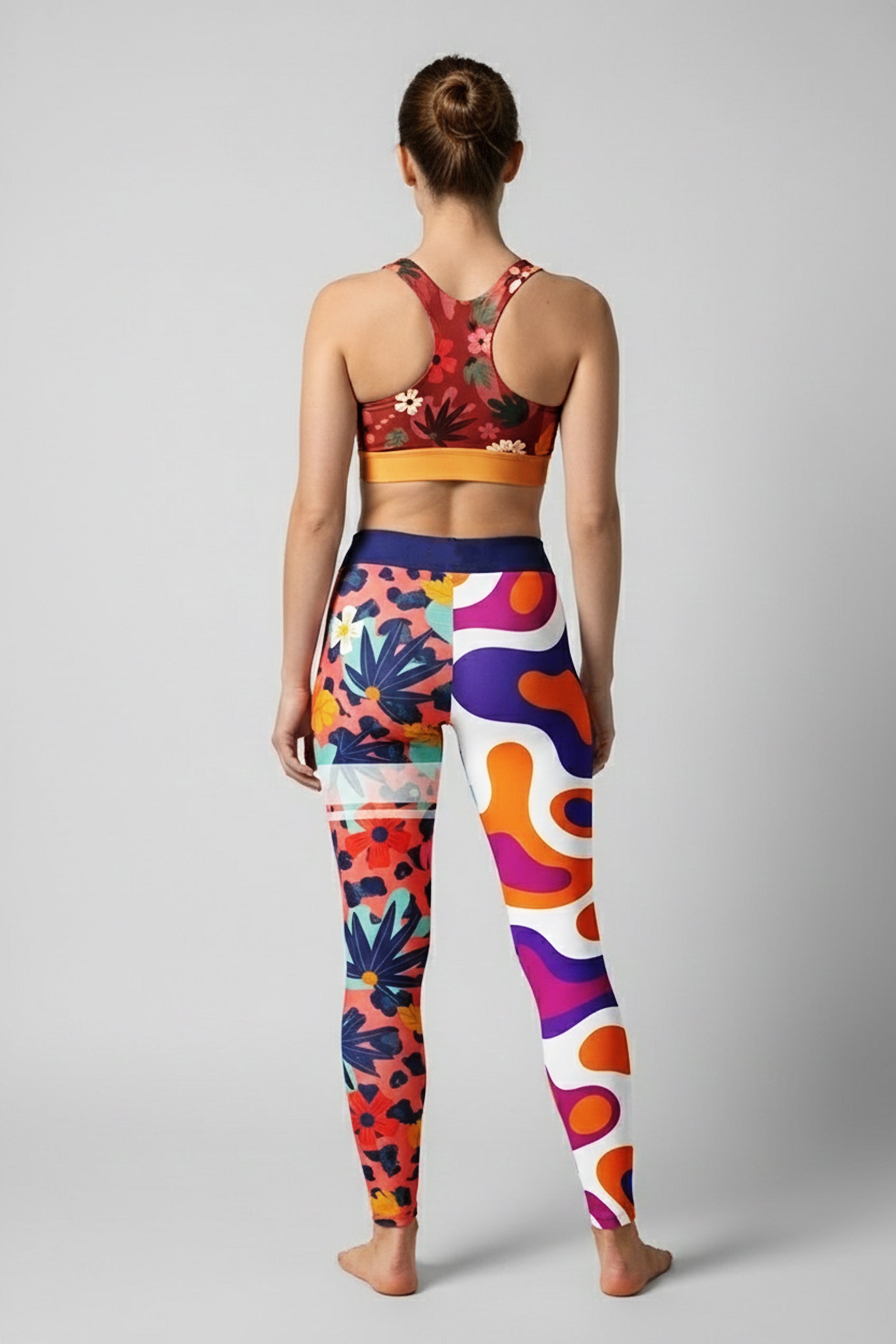 Woman wearing high-waisted personalized leggings with a wild mix of retro and tropical prints.