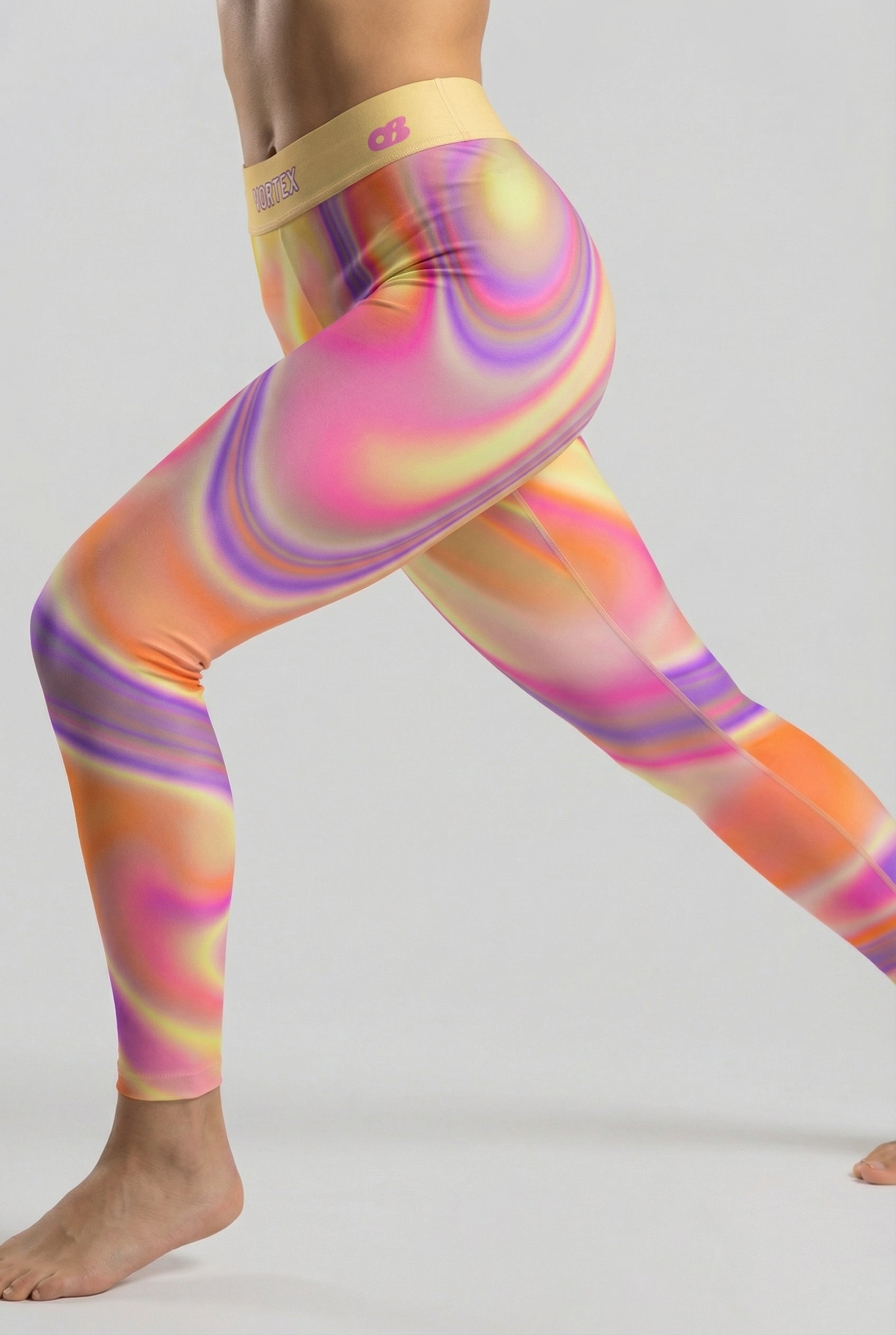 Front view of orange, yellow, and purple tie-dye swirl leggings featuring 'VORTEX' printed on the pastel yellow waistband.