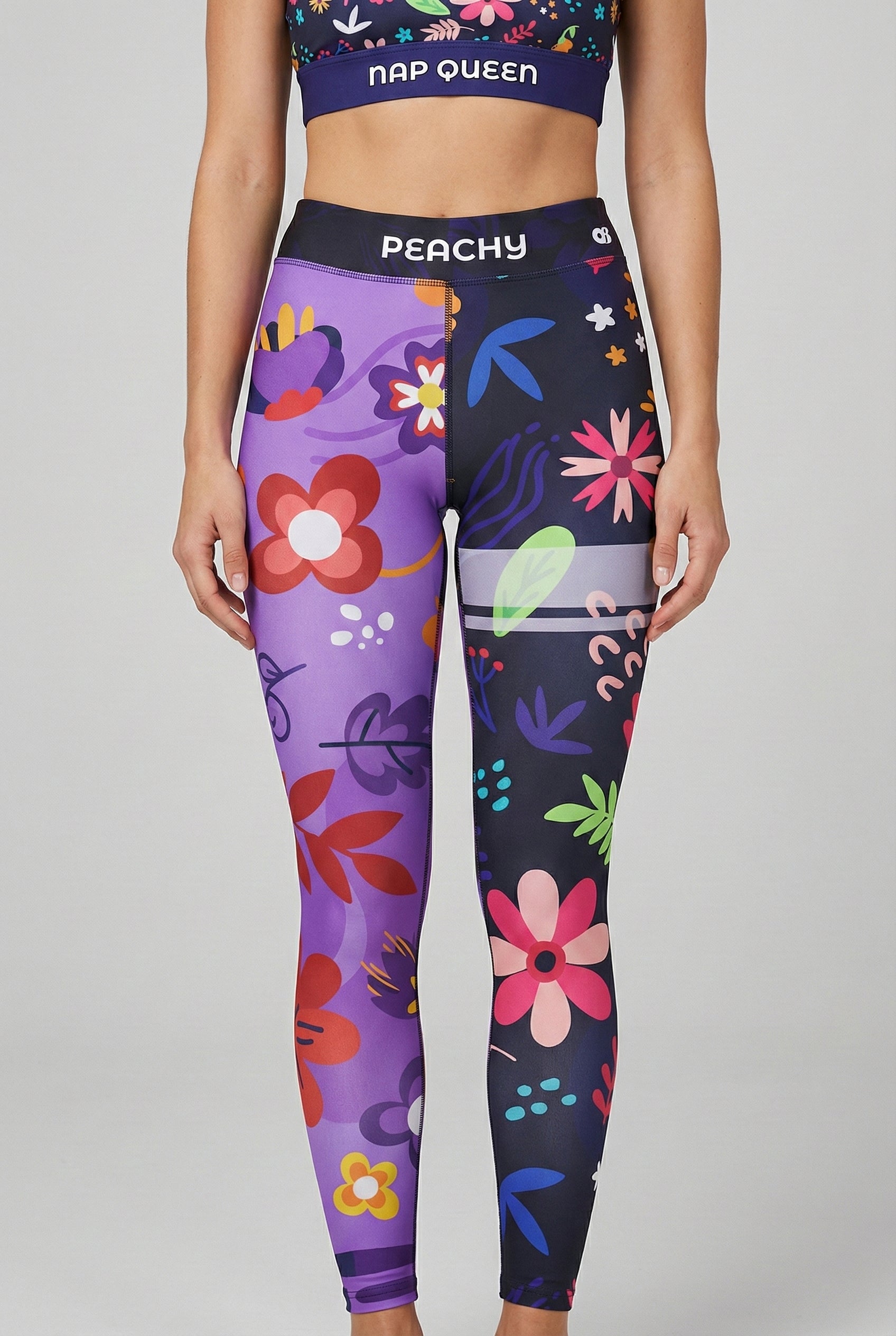 Two-tone leggings with purple and navy legs featuring hand-drawn floral print and custom text 'PEACHY'