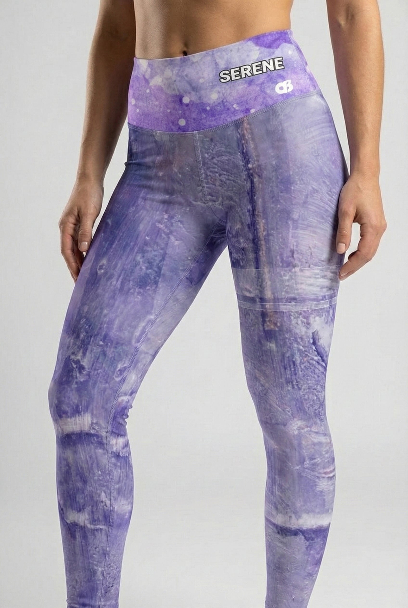 Model posing in custom violet stone leggings.