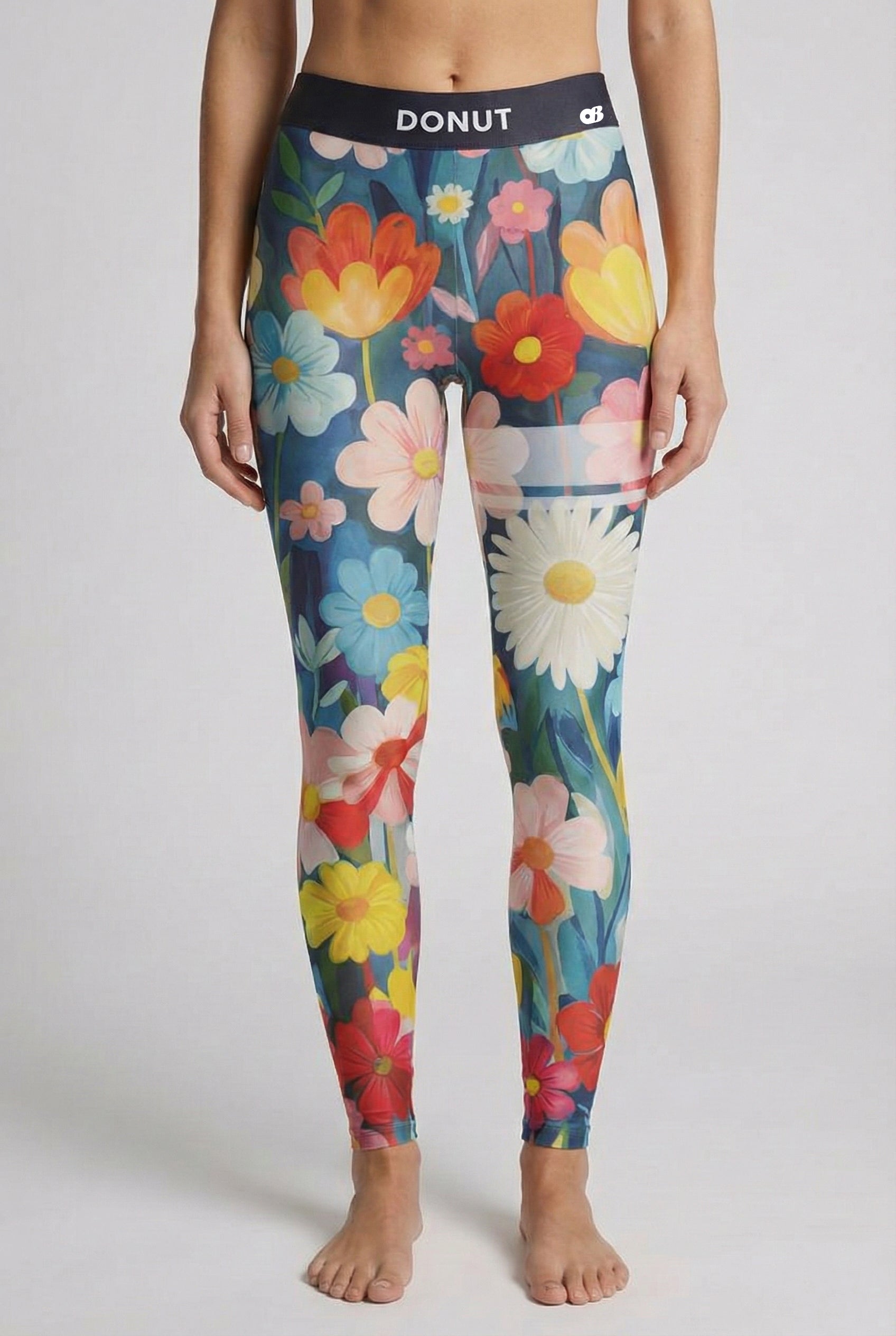 leggings with watercolor floral print and custom text 'DONUT' on waistband.